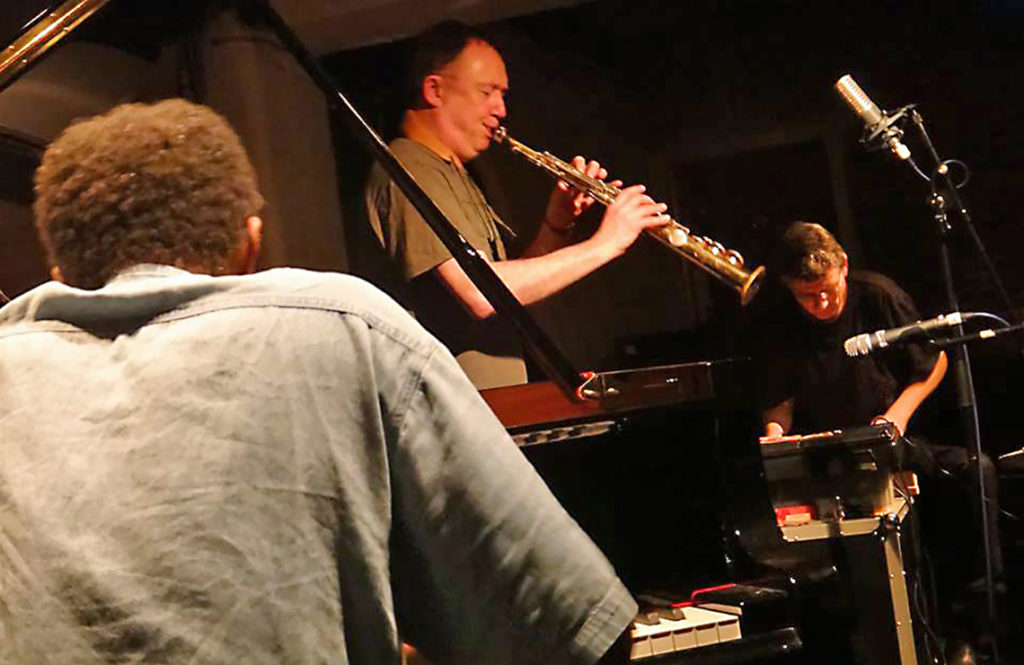musicians playing piano, saxophone, sythesizer