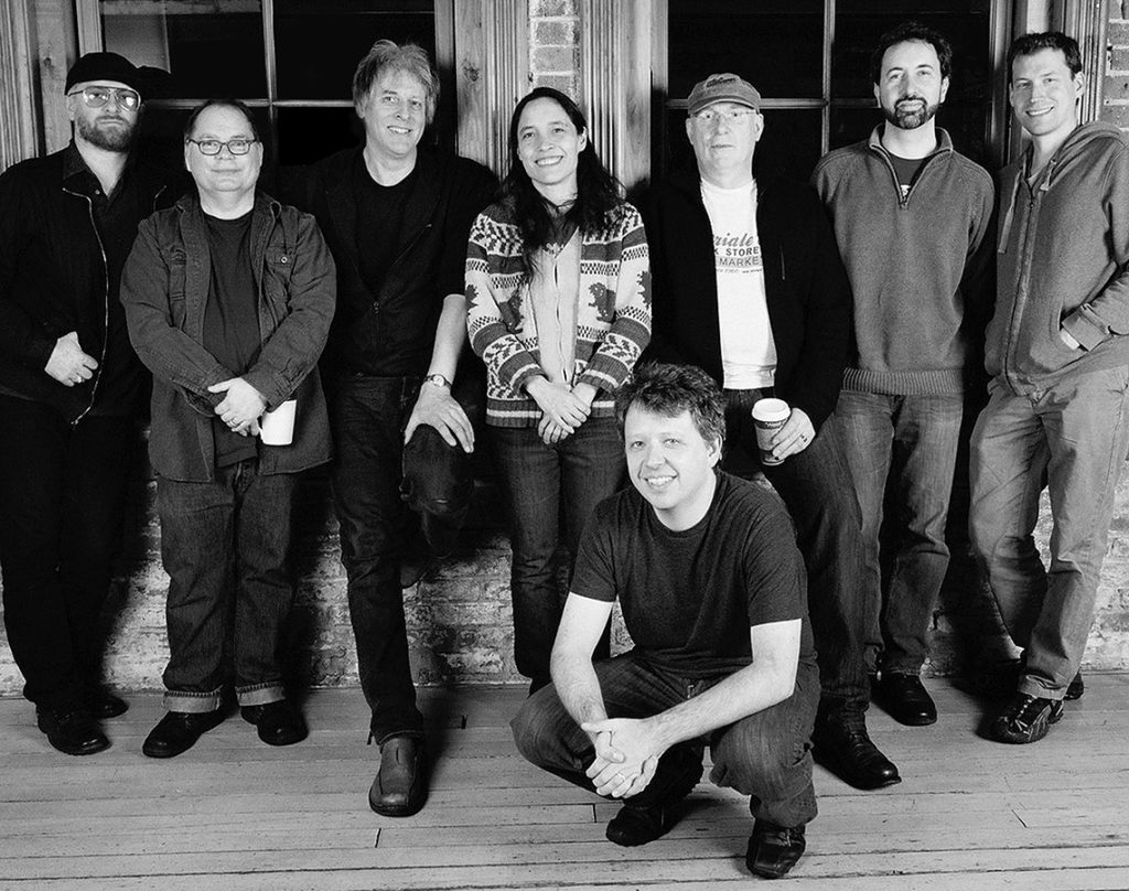 eight musicians posing
