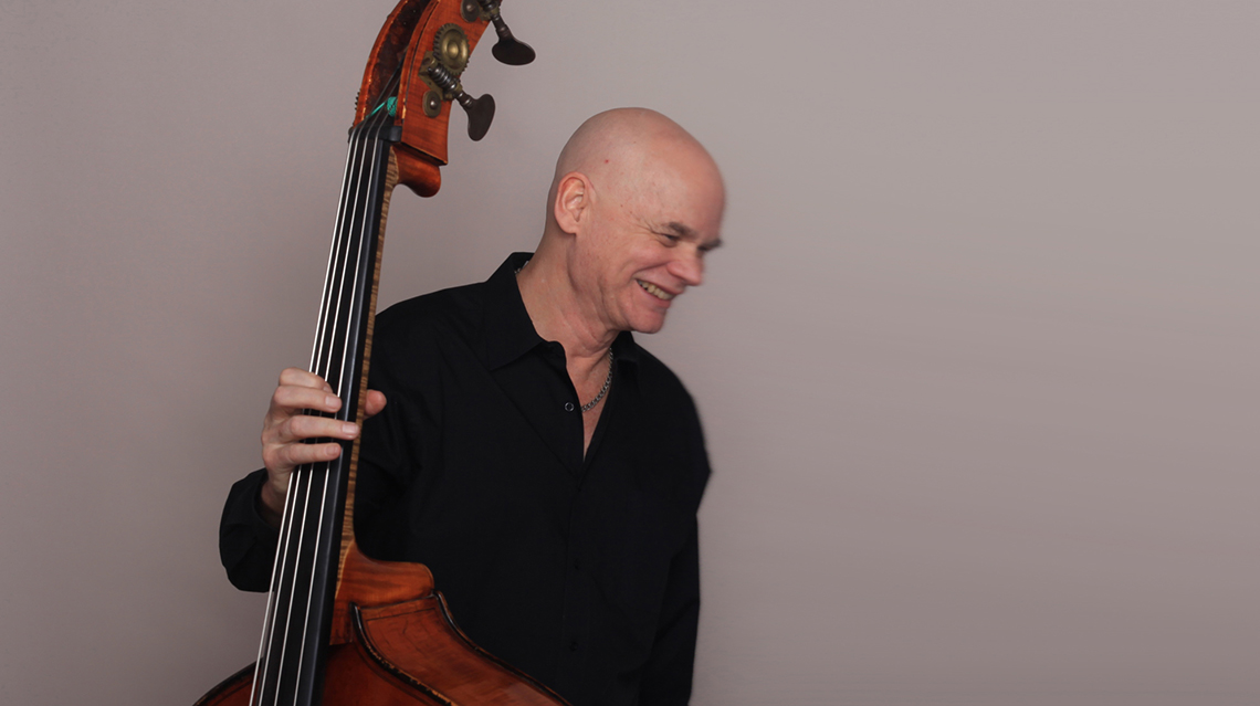 Mark Helias holding a double bass